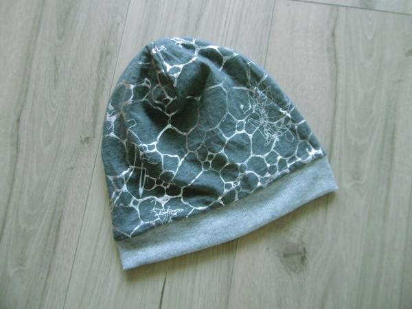 Grauer Wendestoff mit Silberprint